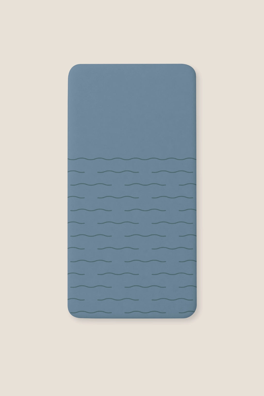 A fitted blue sheet with a subtle wavy horizontal line pattern, shown flat against a light beige background.