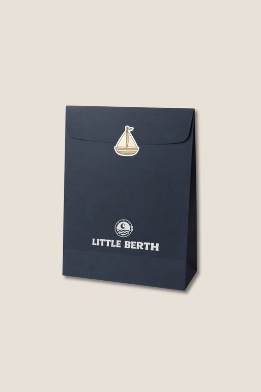 Navy blue packaging with 'Little Berth' branding on a beige background.