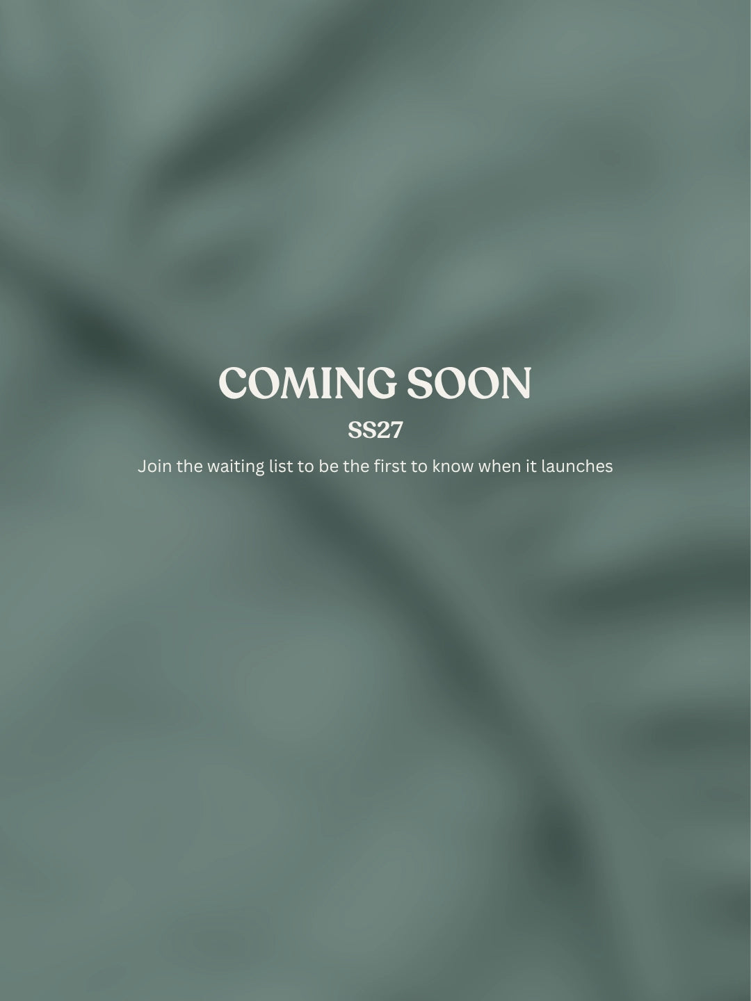 A muted sage green fabric texture background with centered white text reading 'COMING SOON', 'SS27', and smaller text below inviting subscribers to join the waiting list.
